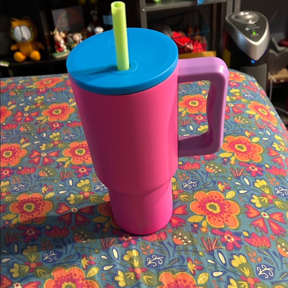 Vibrant Pink Tumbler with Blue Lid and Yellow Straw